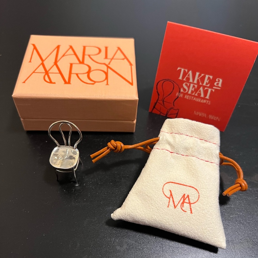 Marla Aaron silver chair, brand new/unused